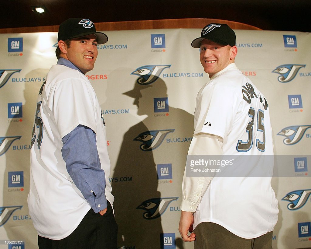 TROY GLAUS and LYLE OVERBAY.12.27.2005. Slugger Troy Glaus and Lyle Overbay are all smiles at the introduction press meet at the Rogers Center Founders Club on Tuesday.(Rene Johnston/ Toronto Star Photo)